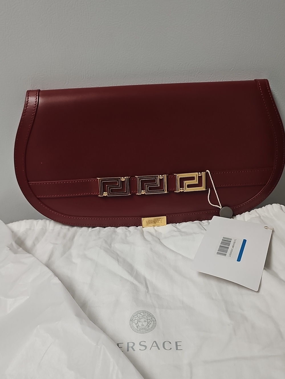 Versace Wine Red Leather Half-Moon Clutch with Gold Greek Key Hardware